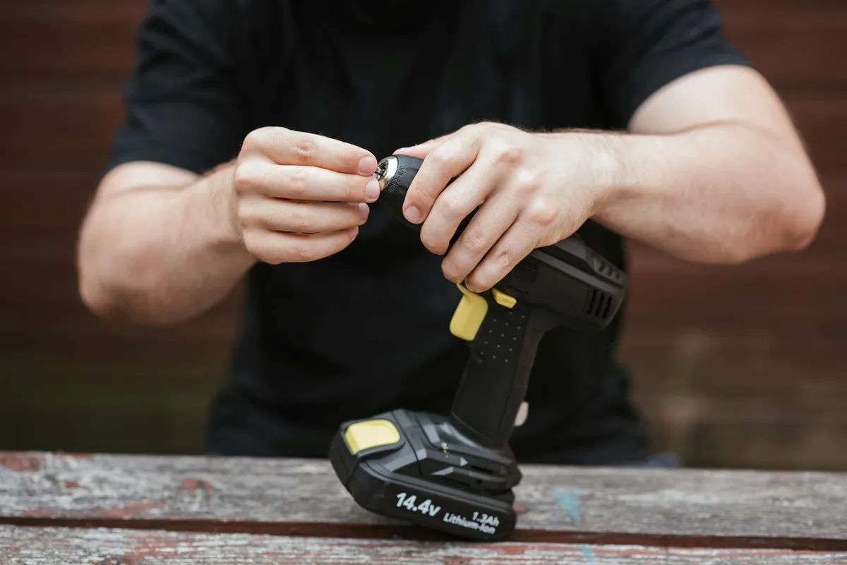 Several cordless drills laid out for comparison
